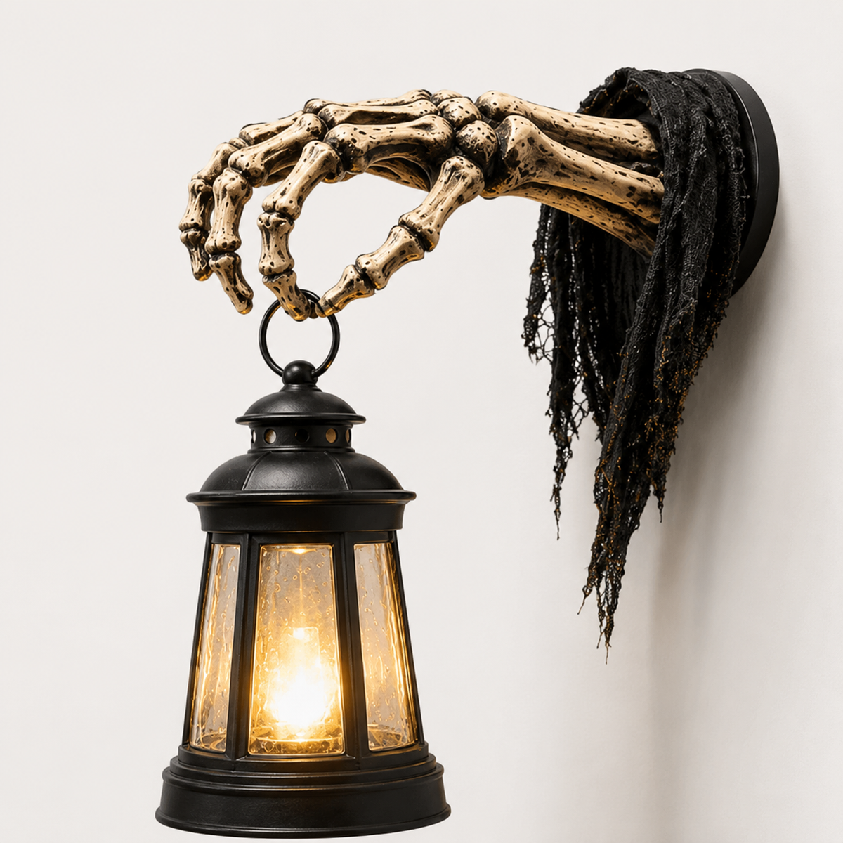 Wall-mounted skeleton hand lantern holder and spooky decor