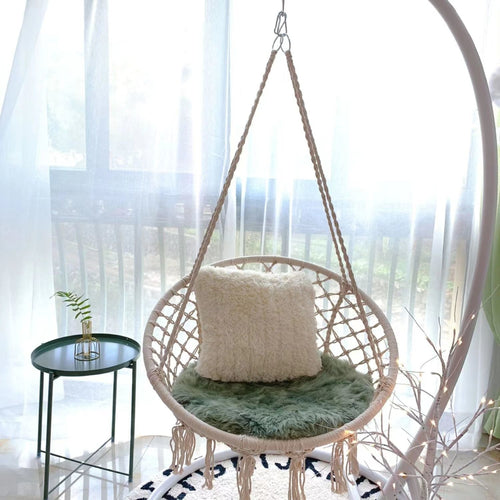 Boho macrame hanging swing chair with faux fur cushion and fringe
